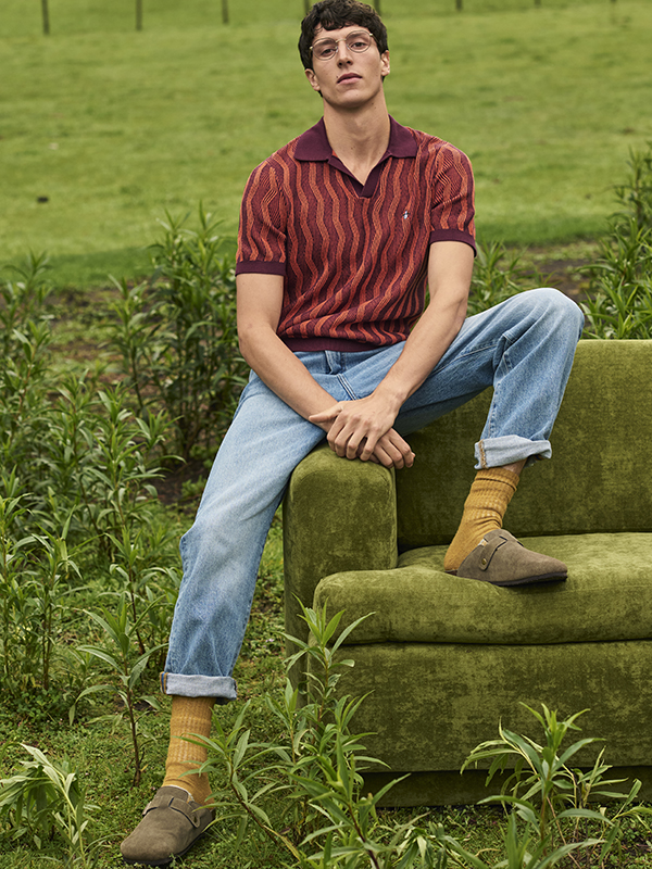 Models wearing Original Penguin Navy Polo with White Lines Border and White Polo with Navy Line Border